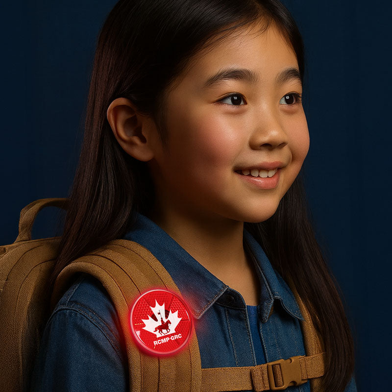 RCMP Flashing Button on a Girl's Backpack